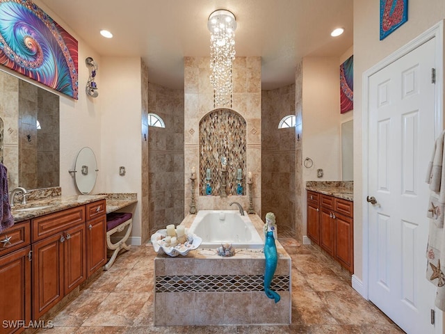 bathroom with vanity, separate shower and tub, and tile walls