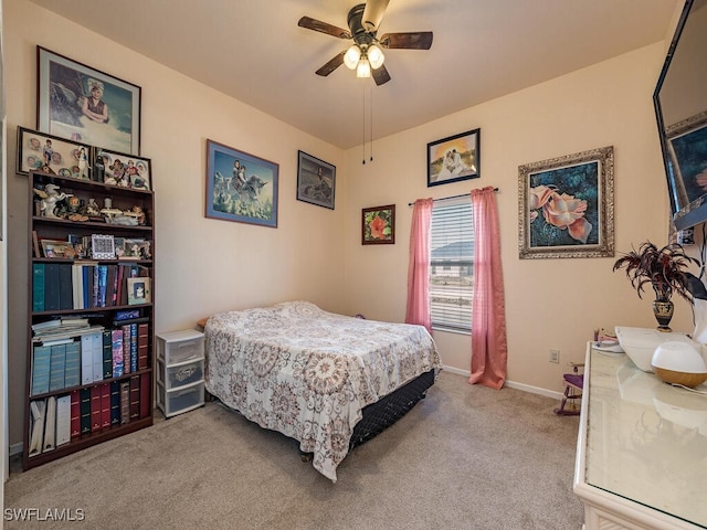 bedroom with light carpet and ceiling fan