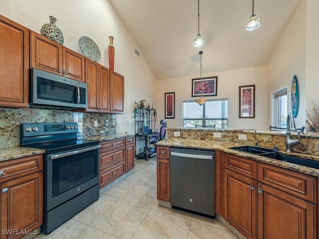 kitchen with appliances with stainless steel finishes, high vaulted ceiling, sink, backsplash, and hanging light fixtures