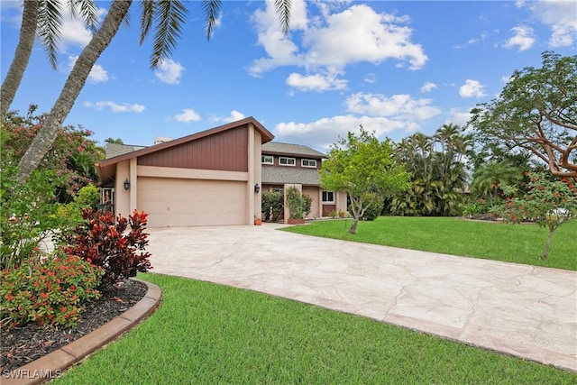 view of front of home featuring a garage and a front lawn