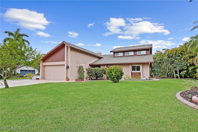 view of front of home featuring a garage and a front lawn