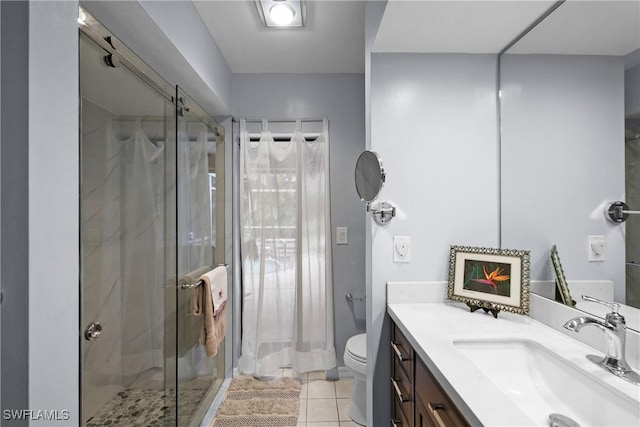 bathroom with walk in shower, toilet, tile patterned floors, and vanity