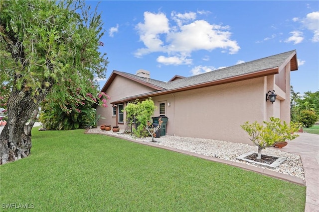 view of home's exterior featuring a lawn