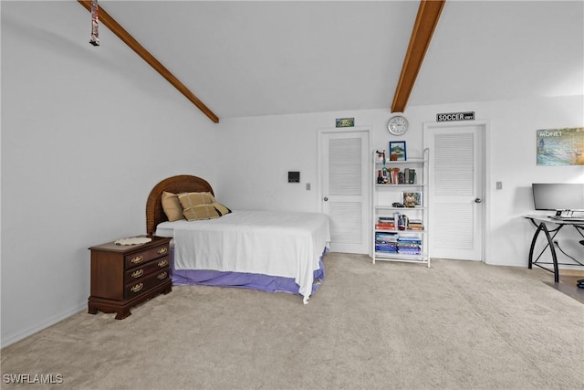 bedroom with carpet flooring and vaulted ceiling with beams