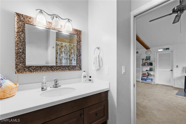 bathroom with beamed ceiling, a shower with shower curtain, ceiling fan, and vanity