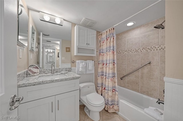 full bathroom with tile patterned floors, toilet, vanity, and shower / bath combo