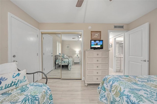 bedroom with a closet, ceiling fan, and light wood-type flooring