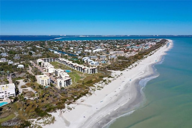 drone / aerial view with a water view and a view of the beach