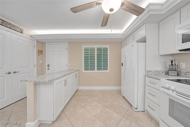 kitchen featuring light stone counters, light tile patterned floors, white appliances, and white cabinets