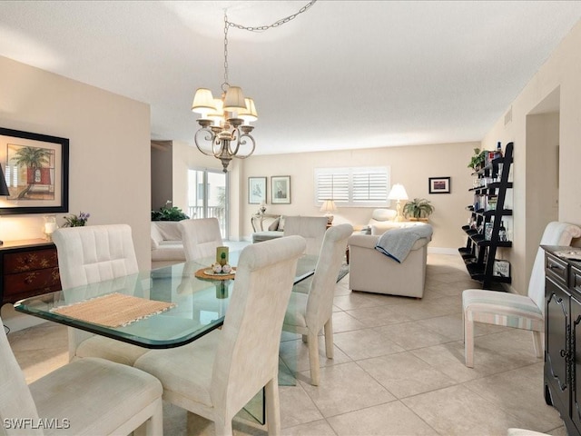 tiled dining area with a notable chandelier