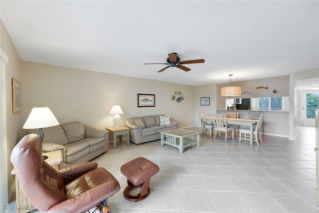 3072 Sandpiper Bay Cir Unit M203, Naples, FL 34112 - living area featuring light tile patterned floors and a ceiling fan