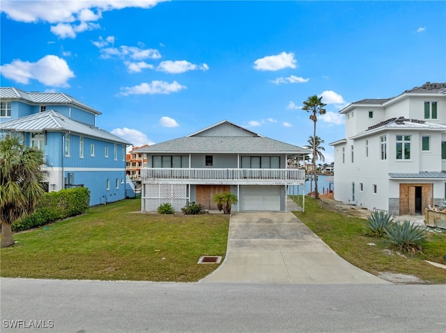 view of front facade with a front yard and a garage