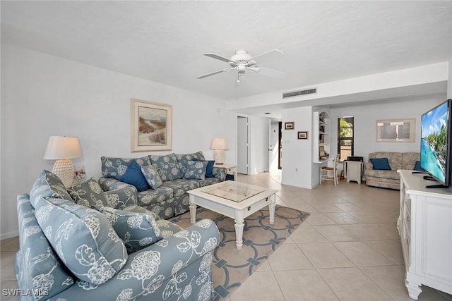 living room featuring ceiling fan and light tile patterned floors