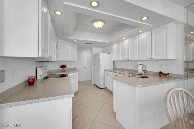 kitchen featuring sink, white cabinetry, a raised ceiling, white appliances, and crown molding