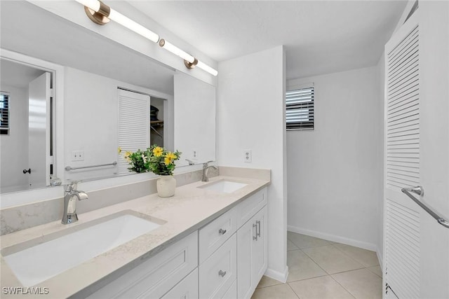 bathroom featuring tile patterned flooring and vanity