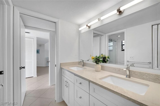 bathroom featuring vanity and tile patterned flooring