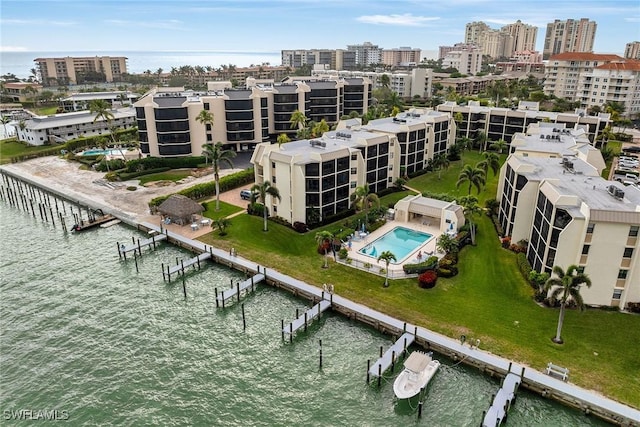 birds eye view of property with a water view