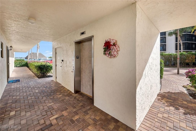 view of patio / terrace featuring elevator