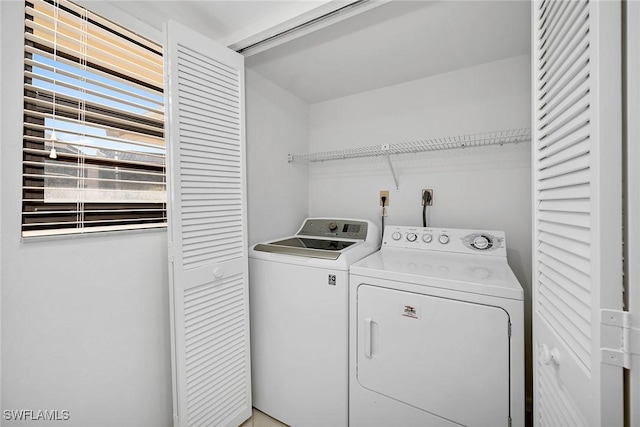 laundry area with separate washer and dryer