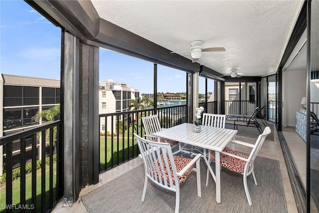 sunroom featuring ceiling fan