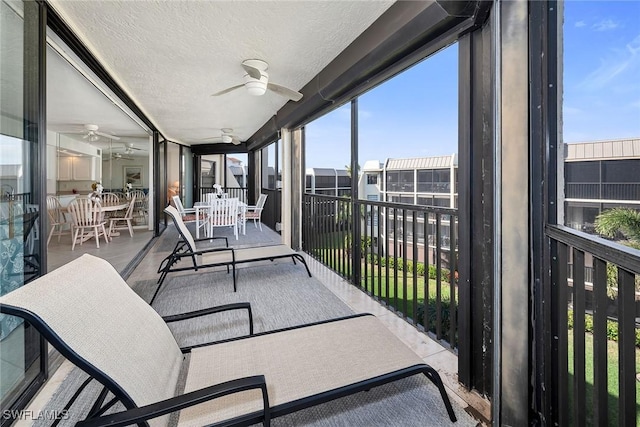 sunroom / solarium with ceiling fan and plenty of natural light