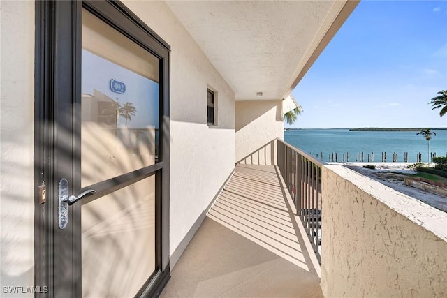 balcony featuring a water view