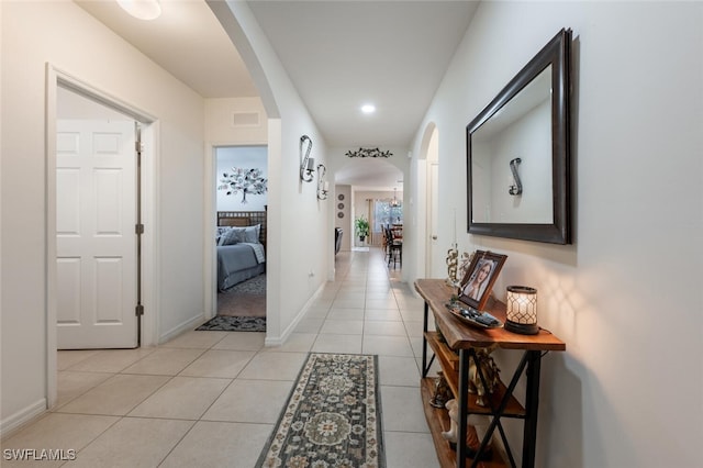 corridor with light tile patterned floors