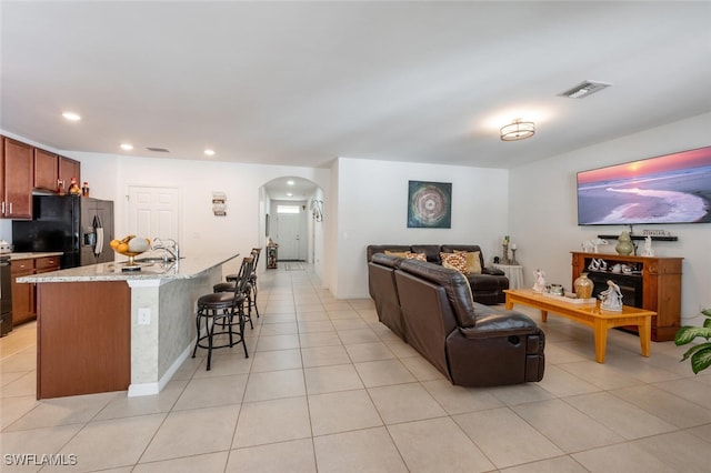 living room with light tile patterned floors