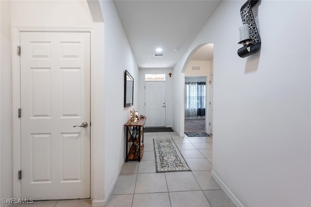 hallway with light tile patterned floors