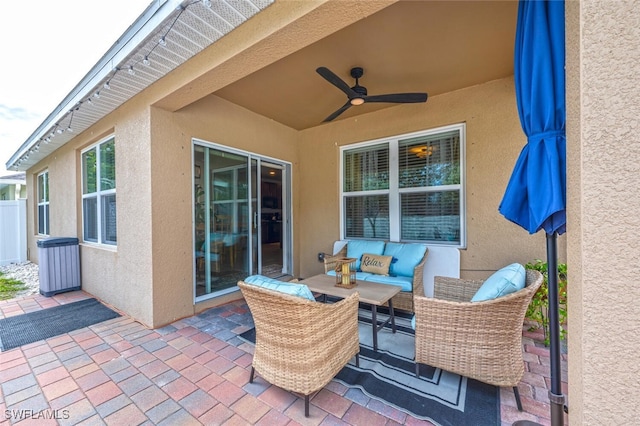 view of patio with ceiling fan and outdoor lounge area