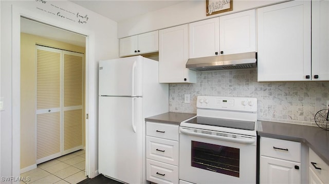 kitchen featuring light tile patterned flooring, white cabinetry, tasteful backsplash, and white appliances