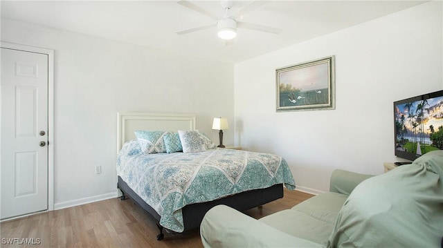 bedroom featuring ceiling fan and hardwood / wood-style flooring