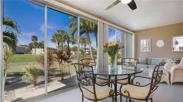 sunroom / solarium featuring ceiling fan and a wealth of natural light