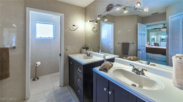 bathroom with vanity, tile patterned flooring, and ceiling fan