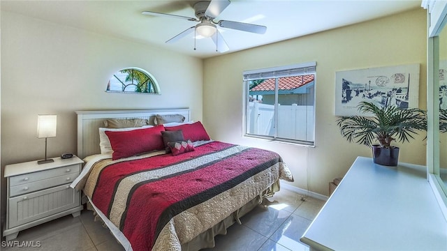 bedroom featuring ceiling fan and light tile patterned floors