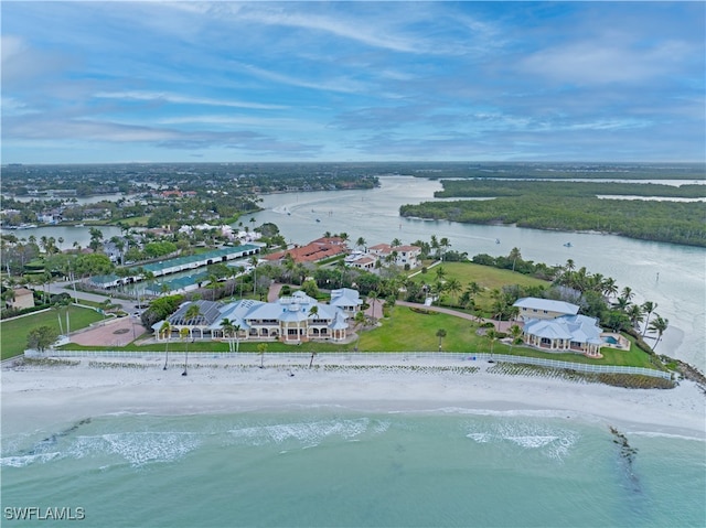 drone / aerial view with a water view and a beach view