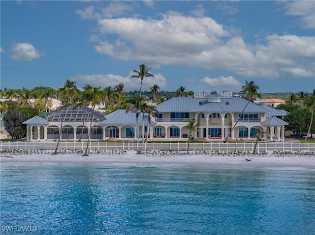 view of pool with a beach view and a water view