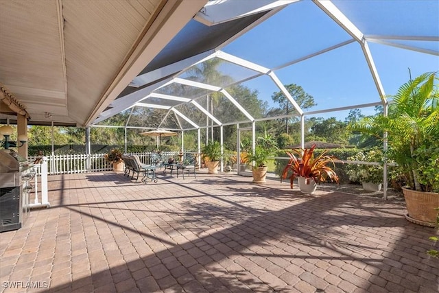 view of patio / terrace with a lanai