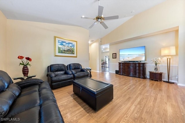 living room with ceiling fan, light hardwood / wood-style flooring, and lofted ceiling