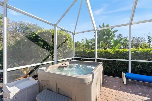 unfurnished sunroom featuring a jacuzzi