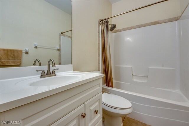 full bathroom featuring toilet, vanity, and shower / bathtub combination with curtain