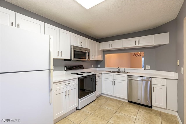 kitchen featuring appliances with stainless steel finishes, sink, white cabinets, light tile patterned floors, and a textured ceiling