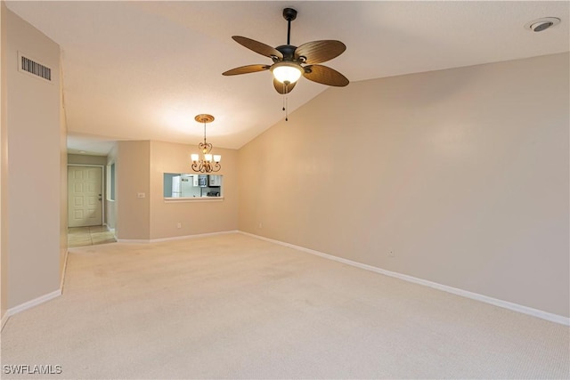 unfurnished room featuring ceiling fan with notable chandelier, vaulted ceiling, and light colored carpet