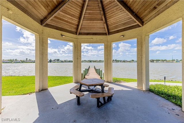 view of patio / terrace featuring a gazebo and a water view