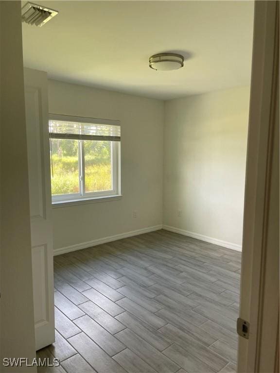 spare room featuring light hardwood / wood-style flooring