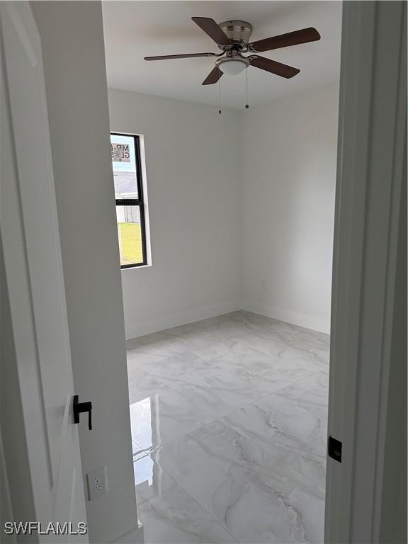 empty room featuring ceiling fan