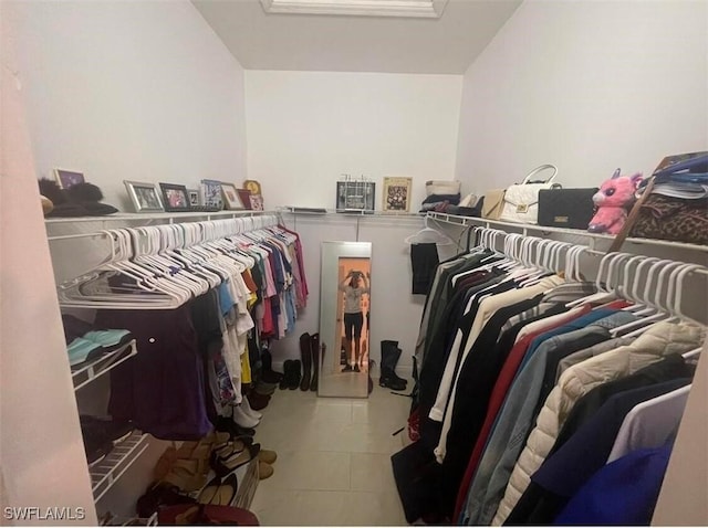 walk in closet featuring tile patterned flooring