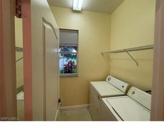 washroom featuring independent washer and dryer