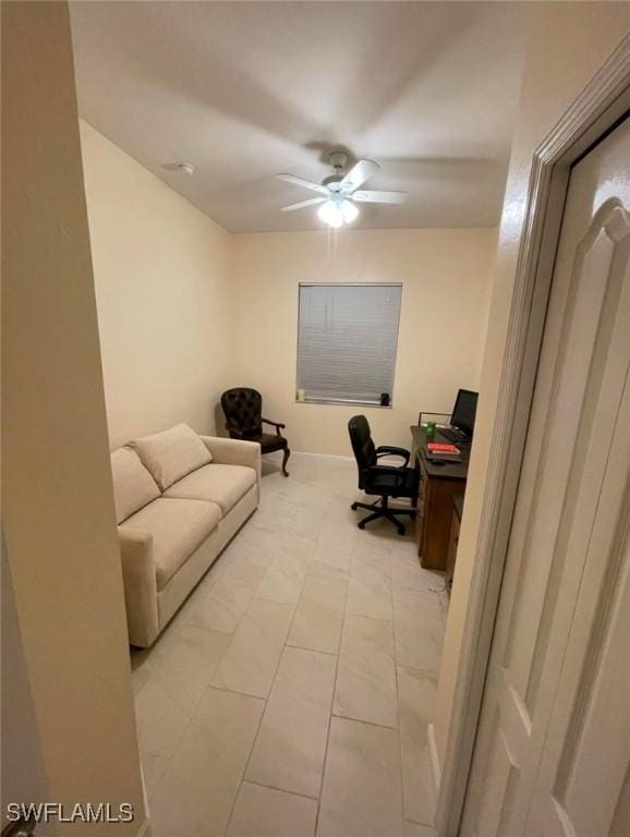 office area with ceiling fan and light tile patterned floors