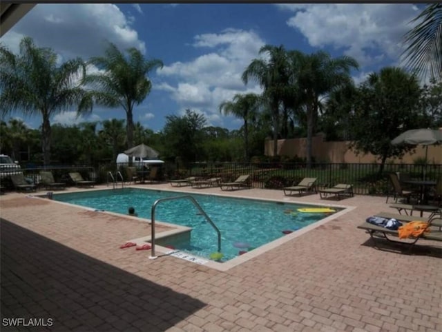 view of swimming pool featuring a patio